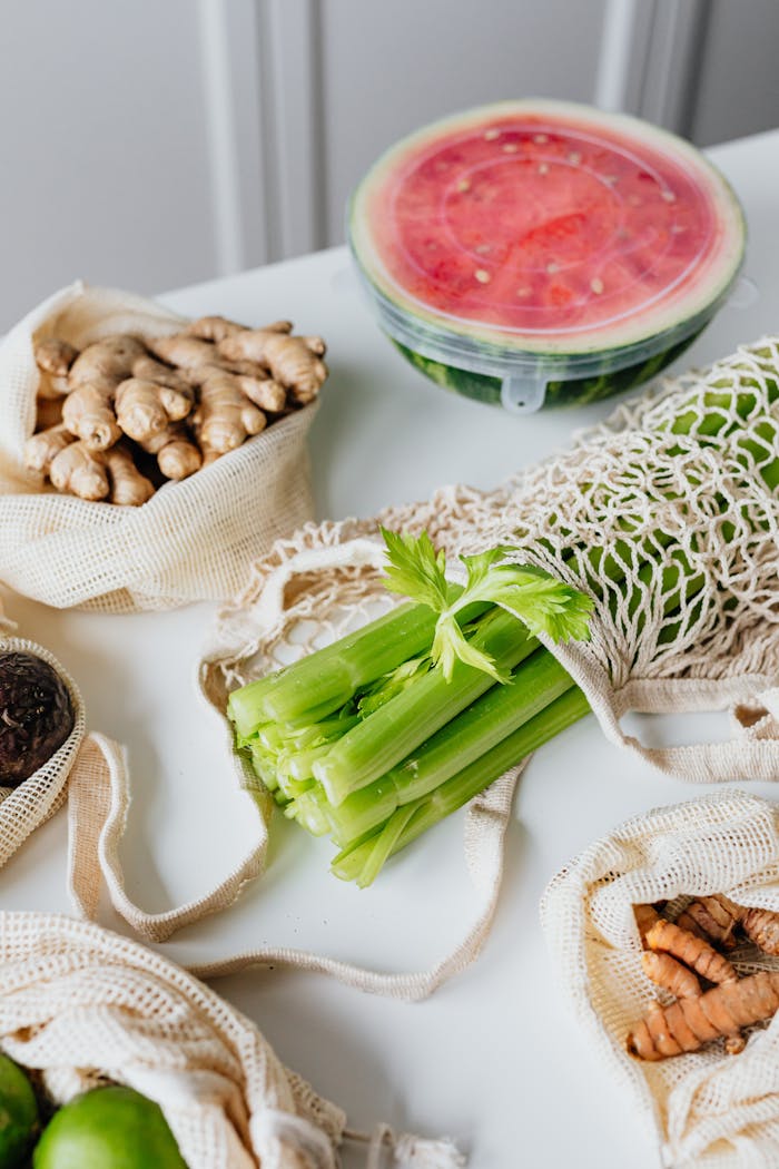 Various fresh vegetables and fruits in reusable bags, promoting a balanced and eco-friendly diet.